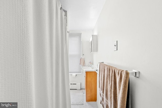73 Fairfield Ave, Lawrence, NJ 08648 - full bath with vanity, a baseboard radiator, and tile patterned flooring