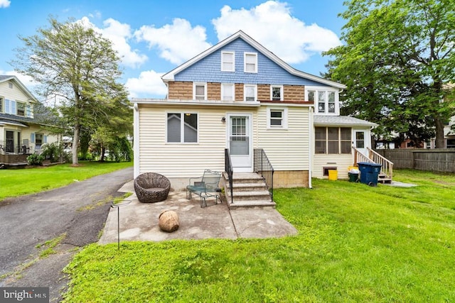 73 Fairfield Ave, Lawrence, NJ 08648 - back of house with entry steps, a patio, and a sunroom