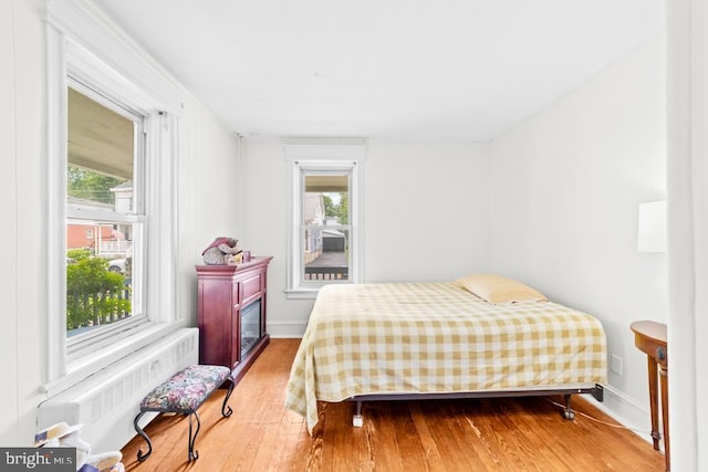 73 Fairfield Ave, Lawrence, NJ 08648 - bedroom with radiator heating unit and wood finished floors