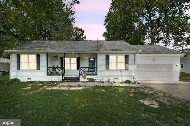 2569 N Independence Dr, Montross, VA 22520 - ranch-style home featuring covered porch, a garage, crawl space, driveway, and a front lawn