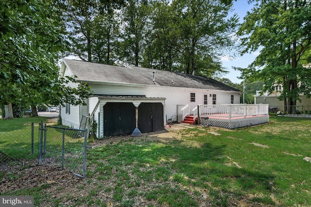 2569 N Independence Dr, Montross, VA 22520 - rear view of house featuring a wooden deck, a storage shed, a gate, and a detached garage