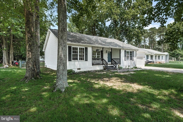 2569 N Independence Dr, Montross, VA 22520 - ranch-style house featuring covered porch, a front yard, crawl space, driveway, and an attached garage
