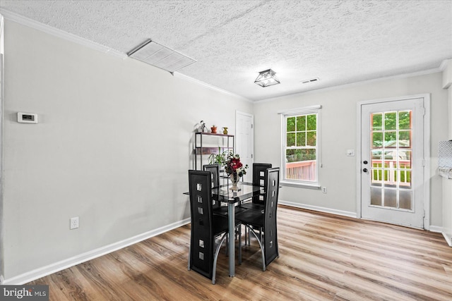 2569 N Independence Dr, Montross, VA 22520 - dining area featuring wood finished floors, a textured ceiling, and ornamental molding