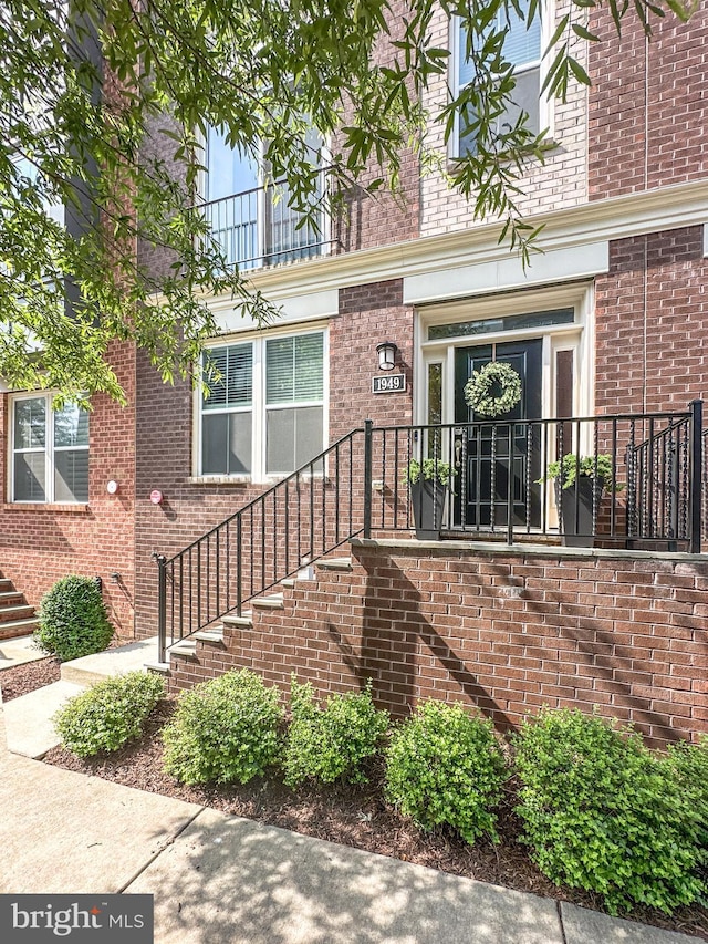 1949 Roland Clarke Pl, Reston, VA 20191 - property entrance featuring brick siding