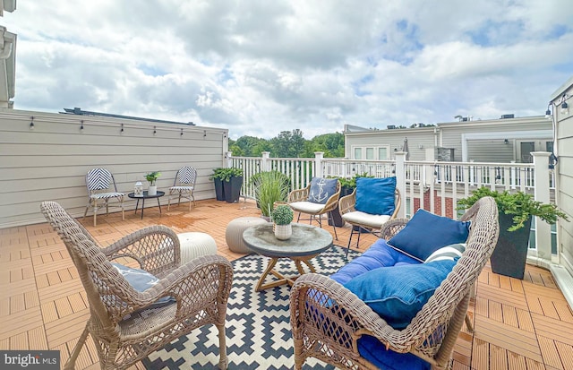 1949 Roland Clarke Pl, Reston, VA 20191 - view of patio featuring outdoor lounge area and a wooden deck