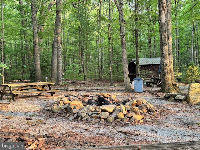 340 Pine Grove Rd, Gardners, PA 17324 - view of yard featuring an outdoor fire pit, a view of trees, and an outdoor structure
