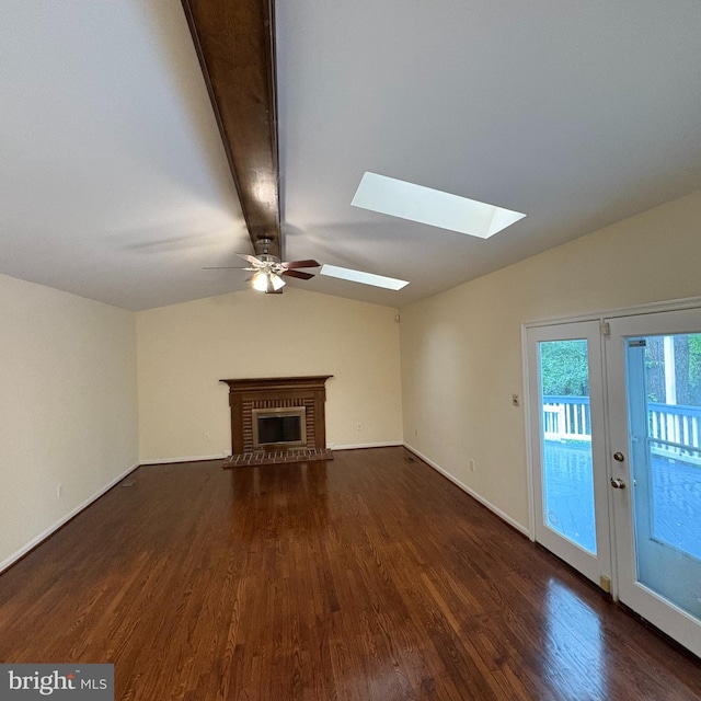 3502 Holly Rd, Annandale, VA 22003 - unfurnished living room featuring a skylight, dark wood-style floors, a ceiling fan, a fireplace, and baseboards