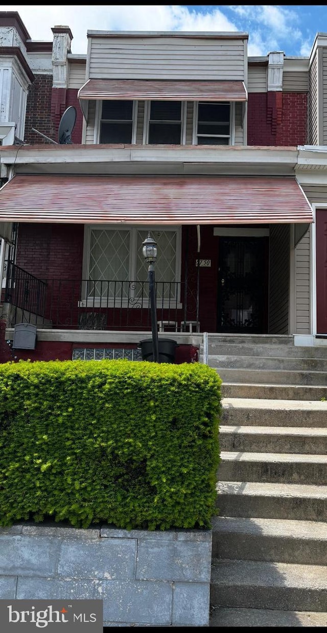 5750 N Woodstock St, Philadelphia, PA 19138 - multi unit property with a porch and brick siding