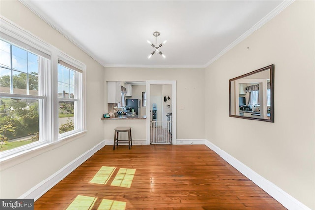 200 Winston Ave, Wilmington, DE 19804 - unfurnished dining area with hardwood / wood-style floors, ornamental molding, and a chandelier