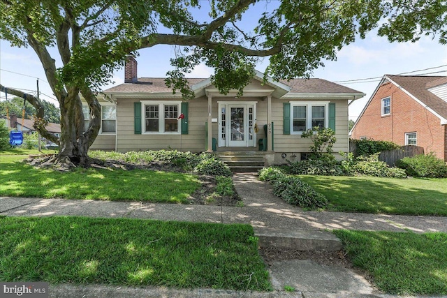 200 Winston Ave, Wilmington, DE 19804 - bungalow-style home featuring a chimney and a front yard