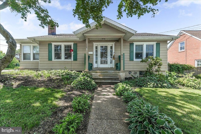 200 Winston Ave, Wilmington, DE 19804 - bungalow-style house featuring a chimney and a front lawn