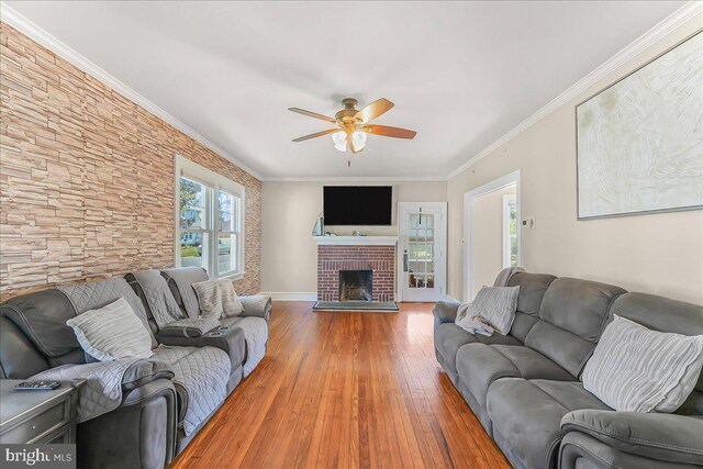 200 Winston Ave, Wilmington, DE 19804 - living area with wood-type flooring, a ceiling fan, crown molding, and a fireplace