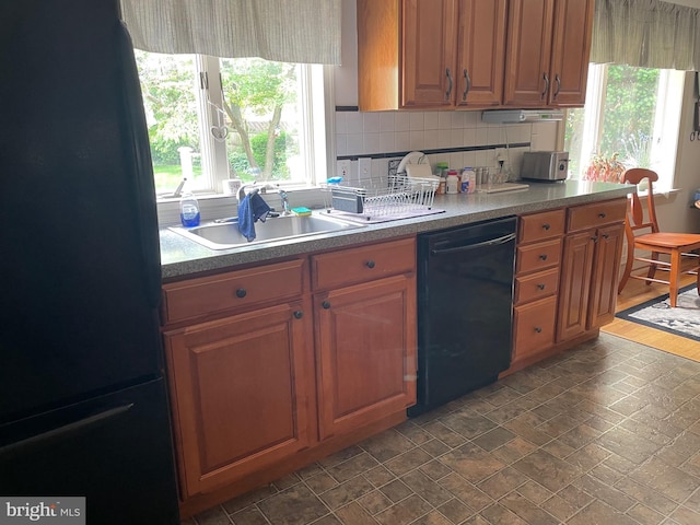 6936 Cedar Ave, Pennsauken, NJ 08109 - kitchen featuring black appliances, decorative backsplash, and brown cabinetry