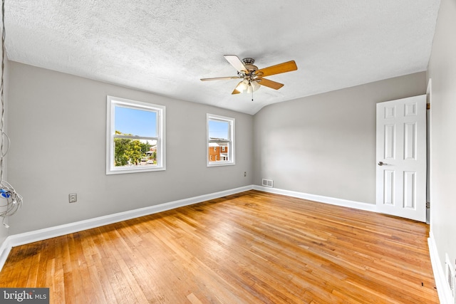 8450 Kavanagh Rd, Dundalk, MD 21222 - empty room with light wood finished floors, a ceiling fan, and a textured ceiling