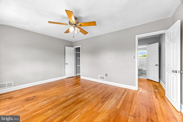8450 Kavanagh Rd, Dundalk, MD 21222 - spare room featuring ceiling fan, light wood-style floors, and a textured ceiling