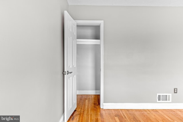 8450 Kavanagh Rd, Dundalk, MD 21222 - unfurnished bedroom with wood finished floors and a closet