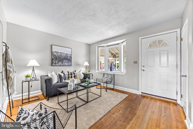 8450 Kavanagh Rd, Dundalk, MD 21222 - living room featuring hardwood / wood-style flooring and a textured ceiling