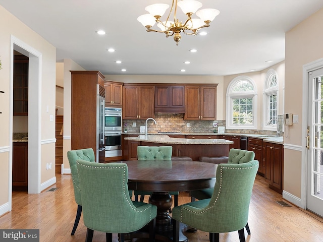 2 N Pheasants Rdg N, Wilmington, DE 19807 - dining room with a chandelier, light wood-style flooring, recessed lighting, and baseboards
