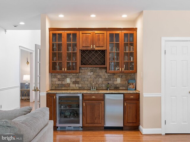 2 N Pheasants Rdg N, Wilmington, DE 19807 - indoor bar with refrigerator, beverage cooler, backsplash, light wood-style flooring, and recessed lighting