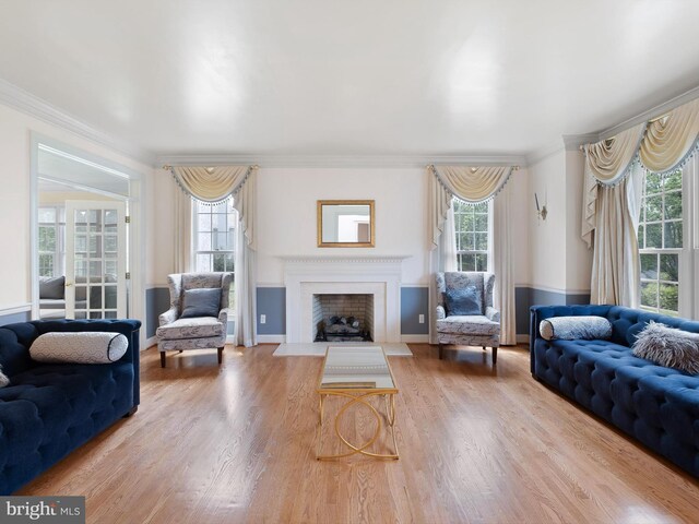 2 N Pheasants Rdg N, Wilmington, DE 19807 - living room featuring ornamental molding, wood finished floors, a fireplace with flush hearth, and baseboards