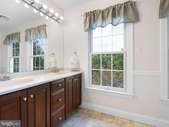 2 N Pheasants Rdg N, Wilmington, DE 19807 - full bathroom with baseboards, plenty of natural light, and double vanity