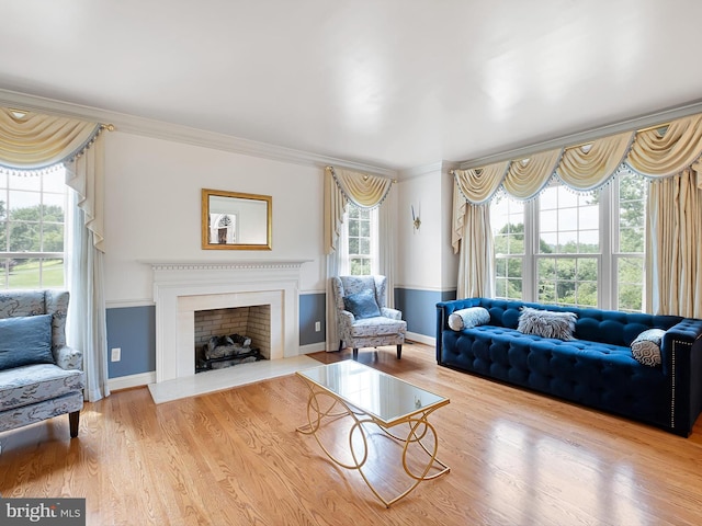 2 N Pheasants Rdg N, Wilmington, DE 19807 - living room featuring ornamental molding, baseboards, wood finished floors, and a fireplace with flush hearth