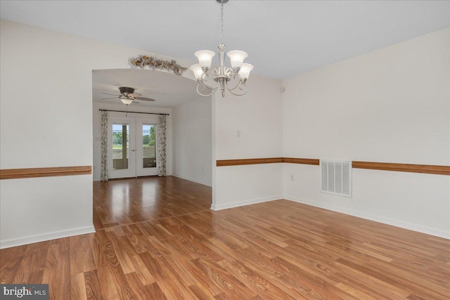 13336 Marquise Dr, Hagerstown, MD 21742 - spare room with light wood-style flooring, a chandelier, baseboards, ceiling fan, and french doors