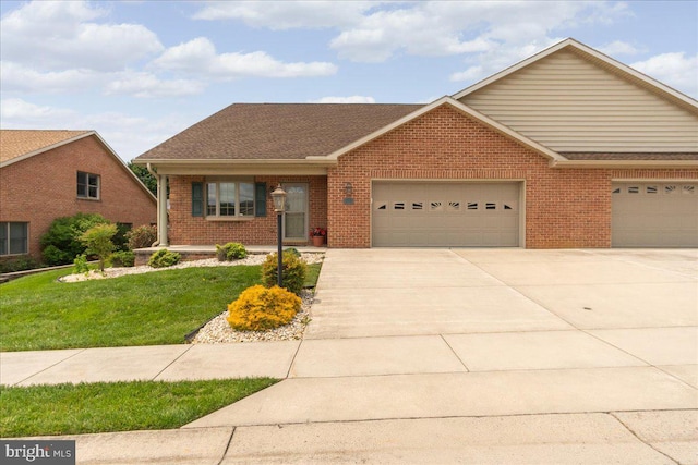13336 Marquise Dr, Hagerstown, MD 21742 - view of front of house with a garage, brick siding, driveway, a front lawn, and roof with shingles