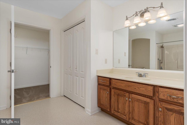 13336 Marquise Dr, Hagerstown, MD 21742 - bathroom with vanity, a shower, and baseboards