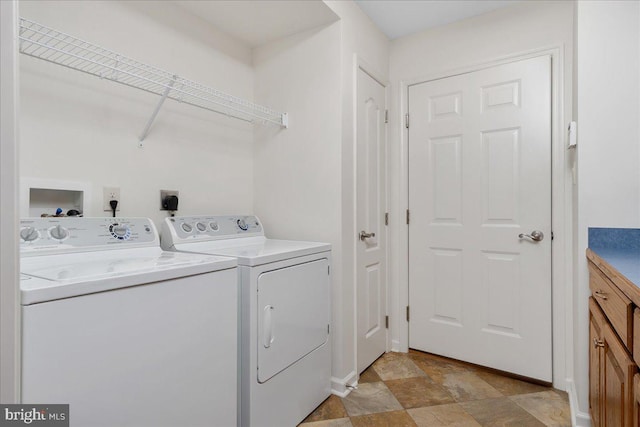 13336 Marquise Dr, Hagerstown, MD 21742 - washroom with washing machine and dryer and stone finish flooring
