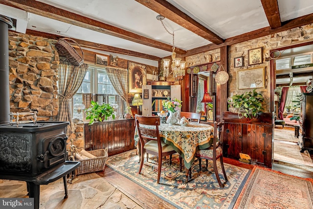 2355 Little Rd, Perkiomenville, PA 18074 - dining room with a wood stove, beamed ceiling, and a chandelier