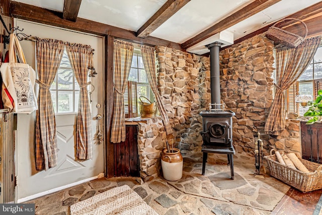 2355 Little Rd, Perkiomenville, PA 18074 - foyer entrance with beamed ceiling, a wood stove, and stone floors