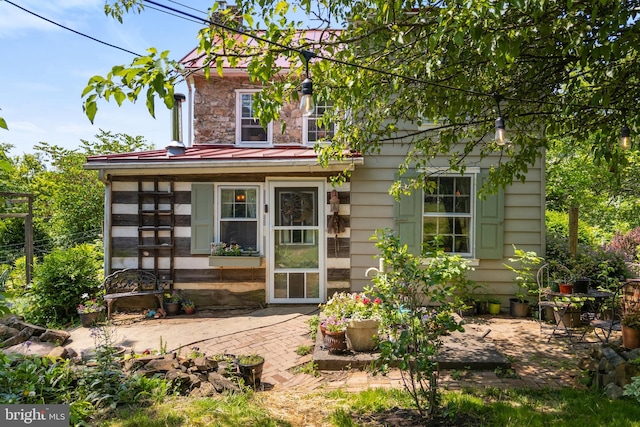 2355 Little Rd, Perkiomenville, PA 18074 - rear view of house with a standing seam roof, a patio, and a metal roof