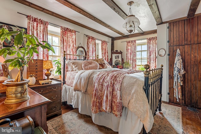 2355 Little Rd, Perkiomenville, PA 18074 - bedroom with dark wood finished floors, multiple windows, and beam ceiling