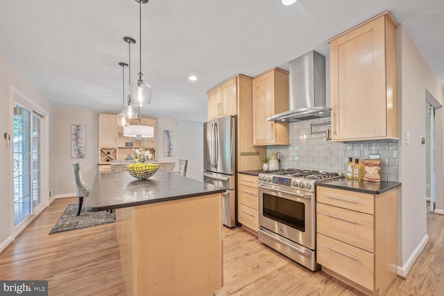 10412 Kinloch Rd, Silver Spring, MD 20903 - kitchen with light brown cabinets, wall chimney range hood, appliances with stainless steel finishes, dark countertops, and light wood-style flooring