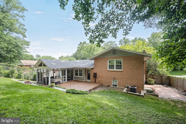 10412 Kinloch Rd, Silver Spring, MD 20903 - back of property with a chimney, a patio area, brick siding, and a fenced backyard