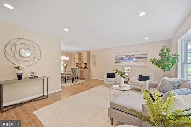10412 Kinloch Rd, Silver Spring, MD 20903 - living area featuring wood finished floors, recessed lighting, and a chandelier