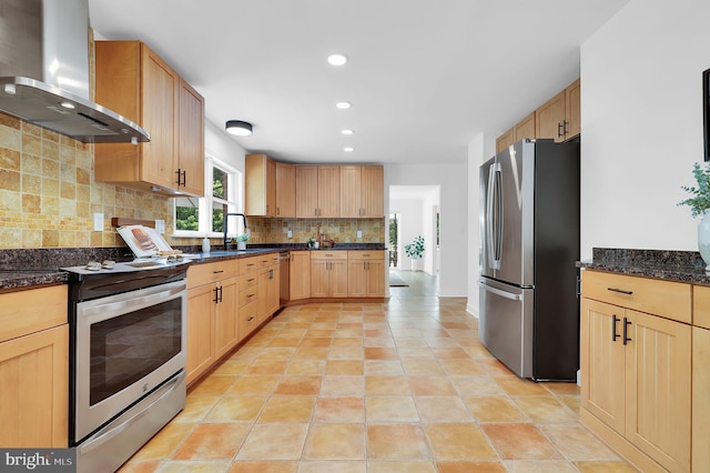 2725 Woodridge Ct, West Friendship, MD 21794 - kitchen featuring stainless steel appliances, wall chimney range hood, light brown cabinetry, tasteful backsplash, and recessed lighting