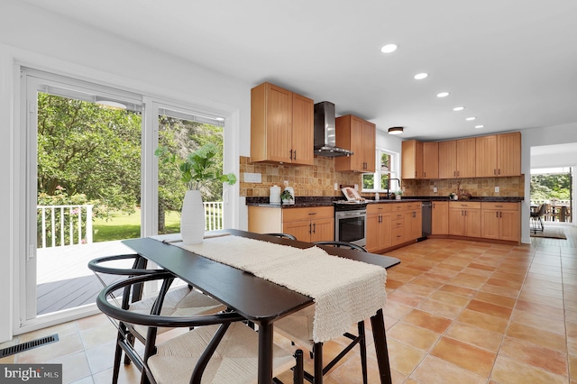 2725 Woodridge Ct, West Friendship, MD 21794 - kitchen featuring wall chimney exhaust hood, tasteful backsplash, dark countertops, appliances with stainless steel finishes, and recessed lighting