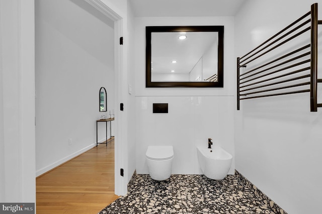 2725 Woodridge Ct, West Friendship, MD 21794 - bathroom featuring a bidet, a towel warmer, and wood finished floors