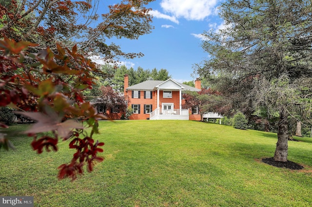 2725 Woodridge Ct, West Friendship, MD 21794 - view of front of property featuring a chimney and a front yard