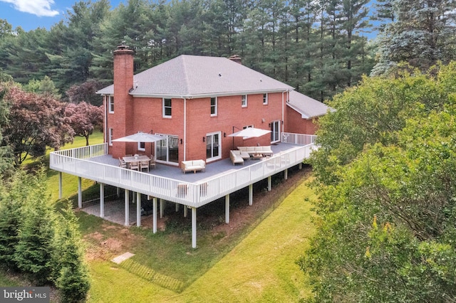 2725 Woodridge Ct, West Friendship, MD 21794 - back of property featuring an outdoor living space, a chimney, a wooden deck, and a lawn