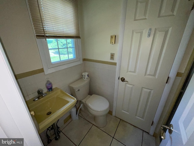 120 Locust Knoll Rd, Downingtown, PA 19335 - bathroom with tile walls, toilet, wainscoting, and tile patterned flooring