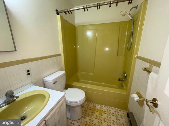 120 Locust Knoll Rd, Downingtown, PA 19335 - full bathroom featuring tile walls, bathing tub / shower combination, toilet, wainscoting, and vanity