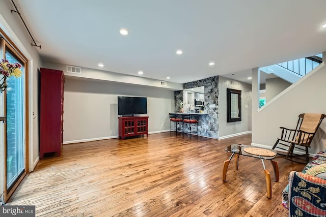 23 Penny Ln Unit 23, Baltimore, MD 21209 - living room featuring wood finished floors, recessed lighting, and stairway
