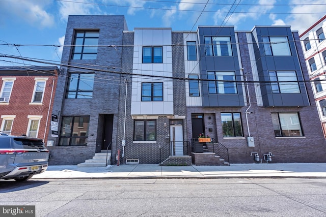 1128 S 24th St S, Philadelphia, PA 19146 - view of property featuring brick siding
