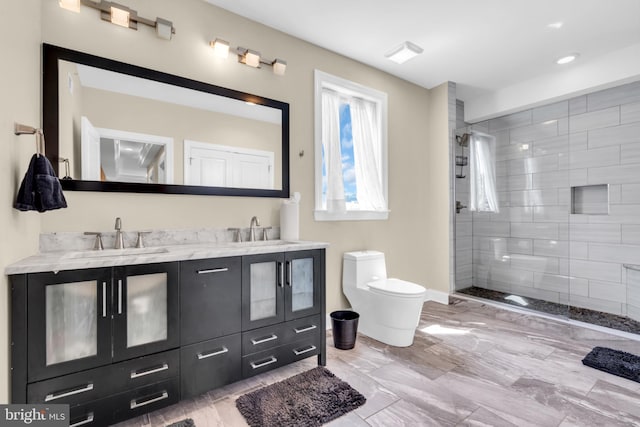 1128 S 24th St S, Philadelphia, PA 19146 - full bath featuring double vanity, a tile shower, and recessed lighting