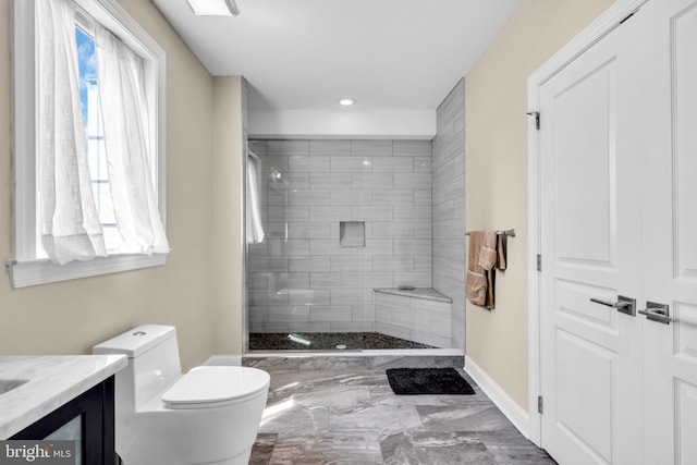 1128 S 24th St S, Philadelphia, PA 19146 - bathroom featuring marble finish flooring, tiled shower, vanity, and recessed lighting