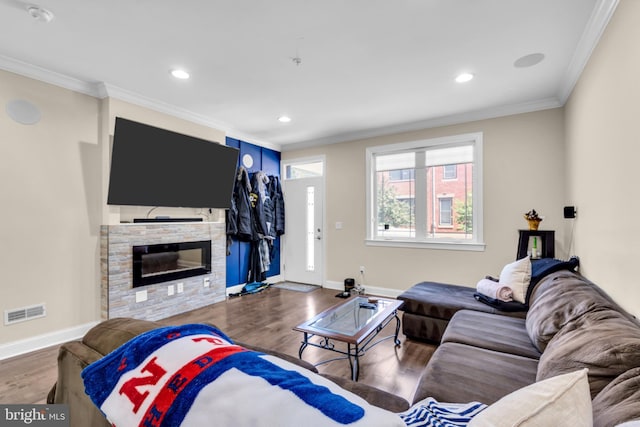 1128 S 24th St S, Philadelphia, PA 19146 - living room with wood finished floors, ornamental molding, a stone fireplace, and recessed lighting