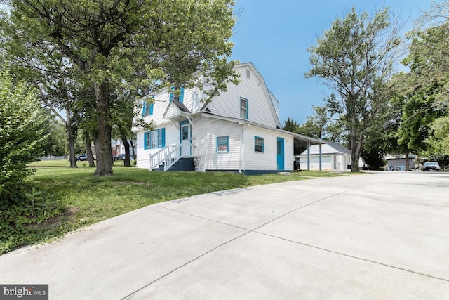 104 Ferndale Rd, Glen Burnie, MD 21061 - view of side of property featuring a gambrel roof, a lawn, and concrete driveway